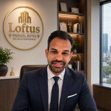 Professional man in a suit at Loftus Medical Suites office.