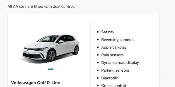 White Volkswagen Golf R-Line with dual control and advanced tech features.
