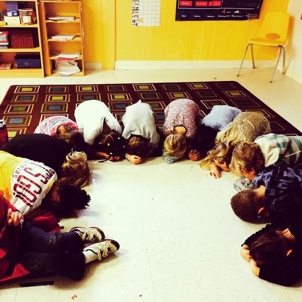 Classroom of students doing yoga