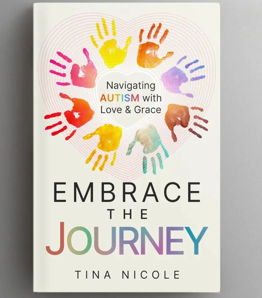 Stack of books next to pencils in a holder and a camera.