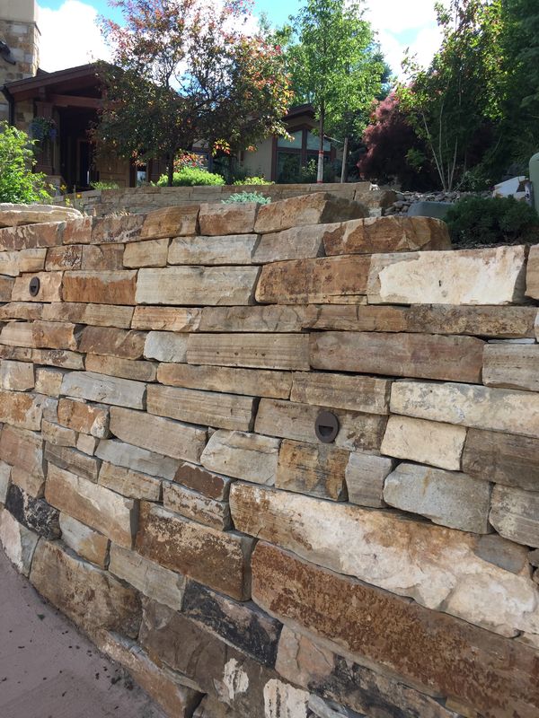 buff flagstone wall with LED lighting