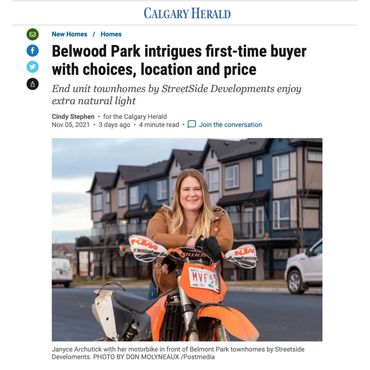 Woman with motorbike in front of townhomes in Belmont Park.