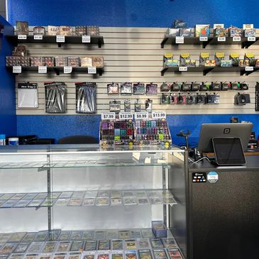 Storefront showing display case, pos system, and product on the walls.