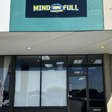 Front of store, showing it's logo above the doors.