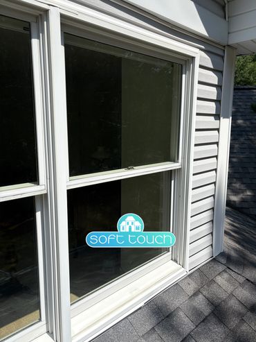 Exterior home window washing with cleaning tools