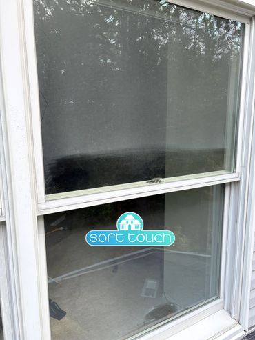 Residential window cleaning service at work