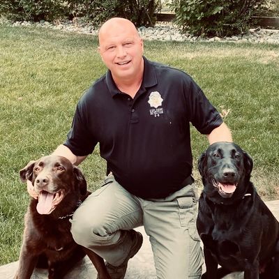 A person with two dogs