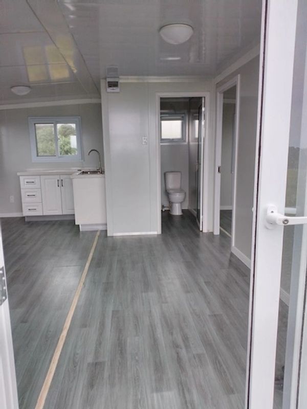 20' tiny home center section showing kitchen left and bathroom center