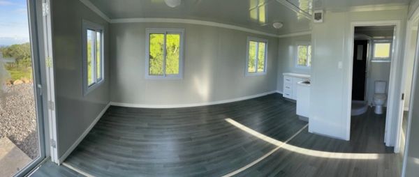 Living Room Panorama showing front door, kitchen area and bathroom 