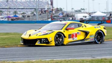 Yellow race car on a track.