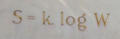 An equation on a tomb shows Boltzmann's constant, entropy and microstate count.