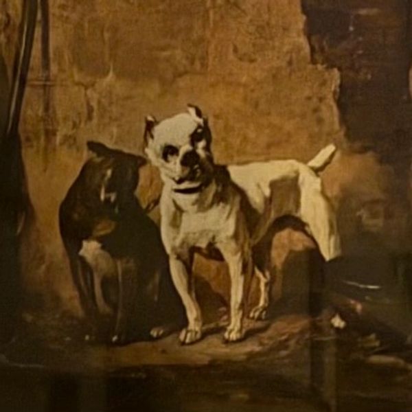Two dogs standing against a rustic wall.