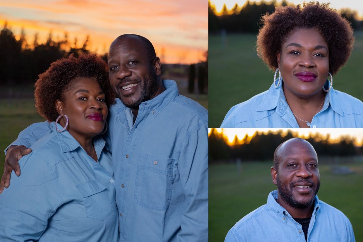 A happy couple poses outdoors at sunset wearing matching blue shirts.