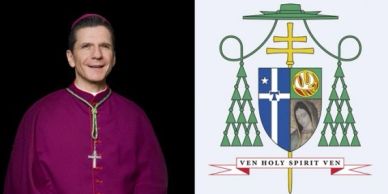 Clergyman in purple attire next to a heraldic coat of arms.
