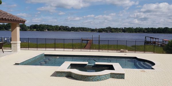 pool with raised spa and glass tile