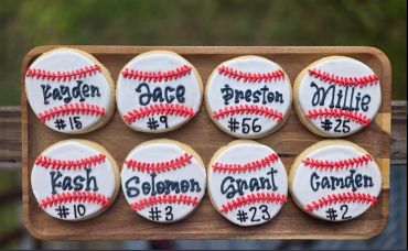 Baseball-themed cookies with names and numbers.