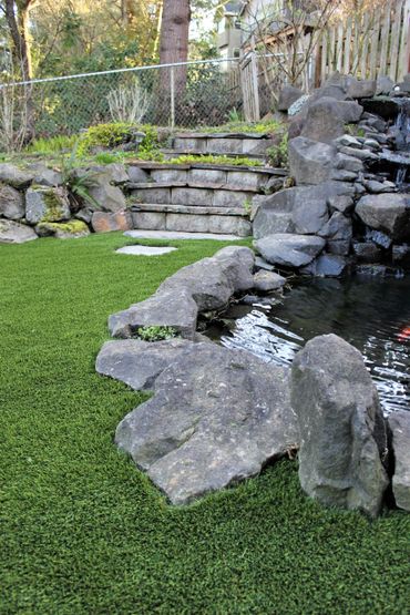 Artificial Grass can be cut into any boarder type.  Looks great around natural settings. 