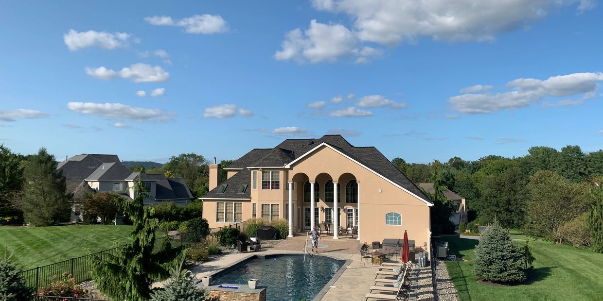 Beautiful house with Owens Corning Duration TruDefinition designer shingles in Black Sable.