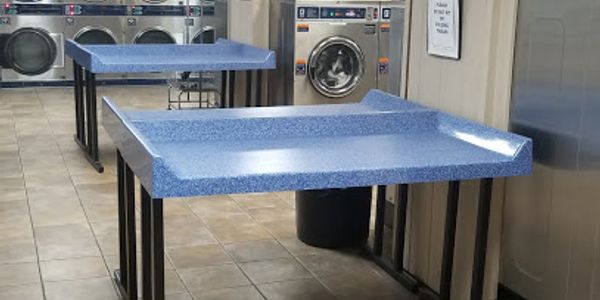 Laundromat folding station