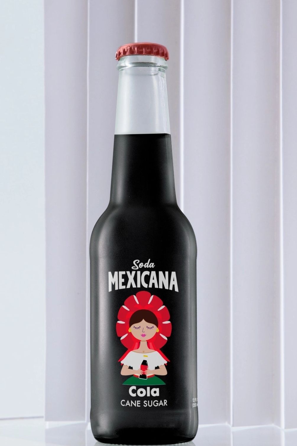 Transport yourself to the lively streets of Mexico with every sip of this authentic Mexican Cola. Th