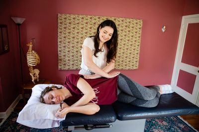 Kate Palmer, Founder of Flourish Concierge PT, assisting a client