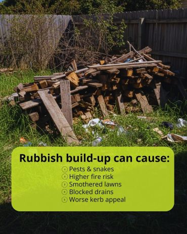 Piled wood and rubbish with warning about risks of rubbish build-up.