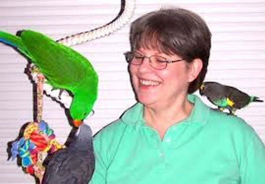 Kris Porter with parrots