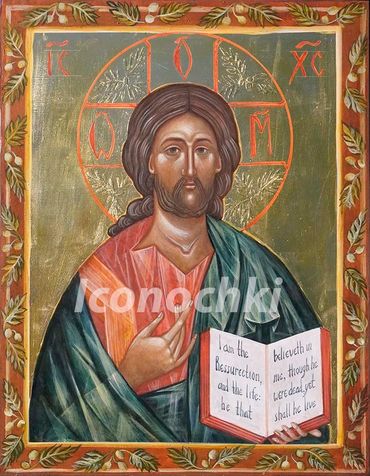 Religious icon of Jesus Christ holding an open book with a halo and decorative border.