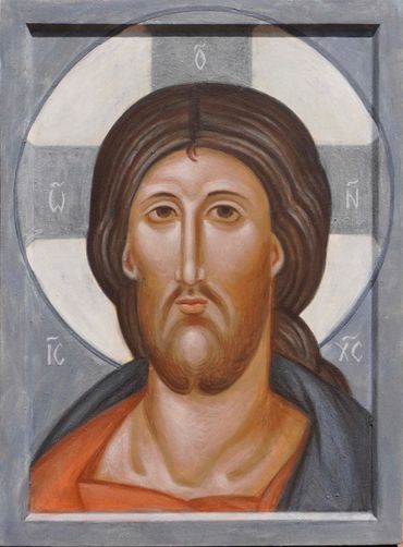 Iconic portrait of Jesus Christ with a halo and traditional Orthodox style.
