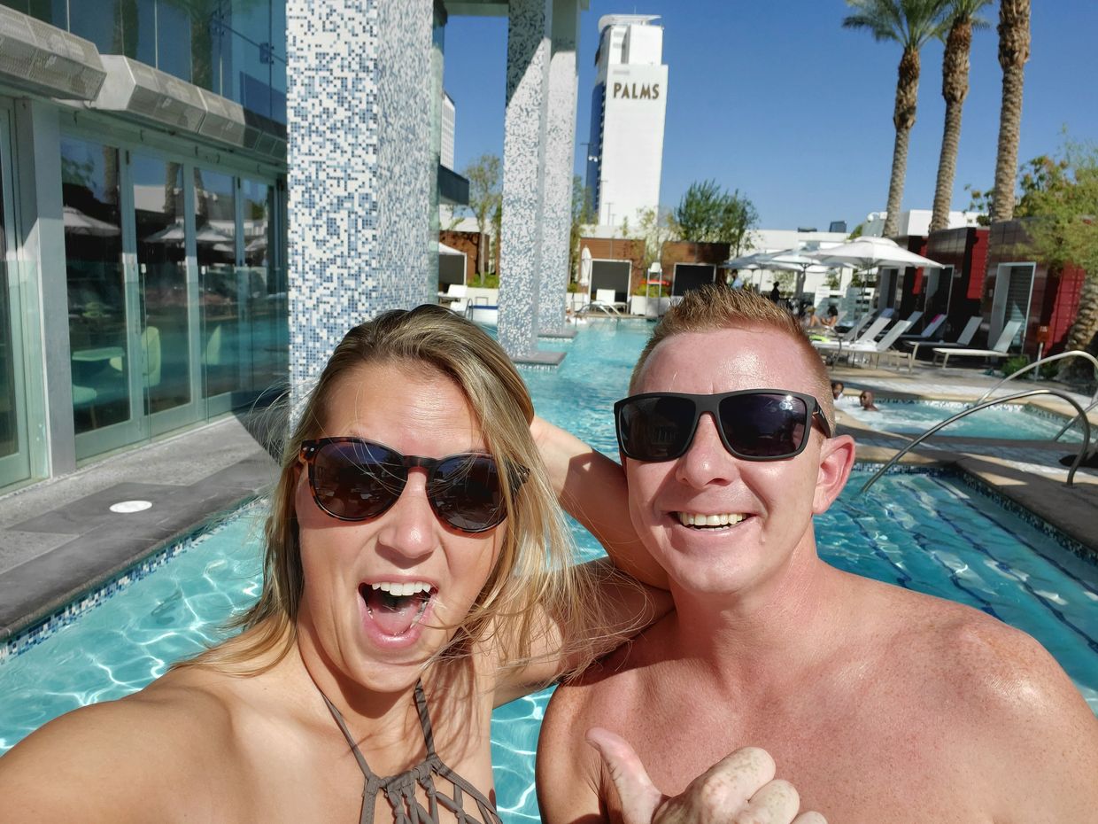 man and woman standing in front of pool in Las Vegas