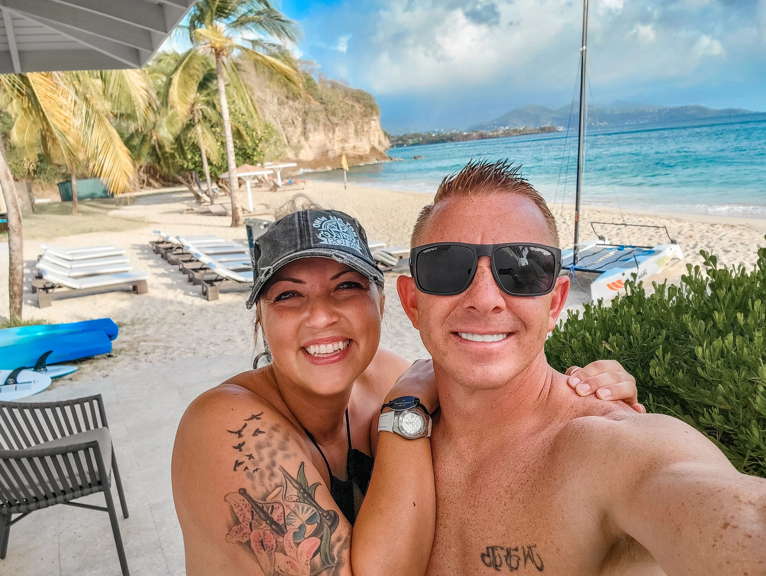 Man and woman standing near the beach in Grenada at the Royalton Grenada.