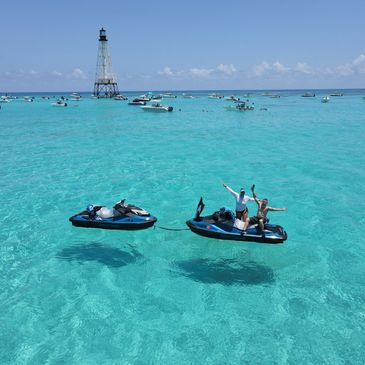 Two jet ski's at Alligator Reef Lighthouse in the Florida Keys