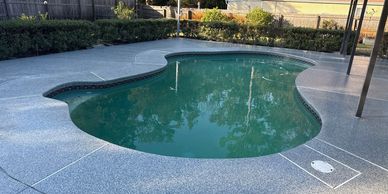Pool deck with Stonewash Decorative Flake System. 