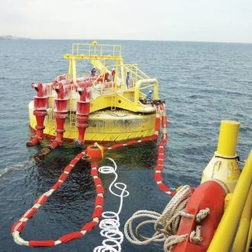 Yellow marine buoy system floating on the ocean.