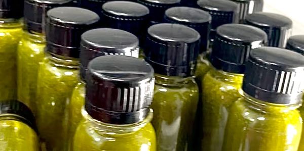 green juice in mini-bottles