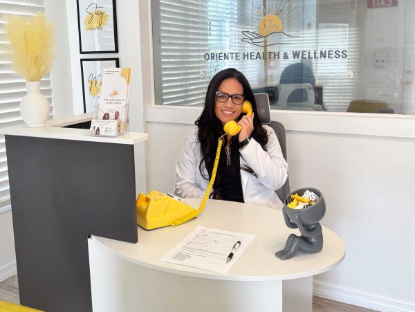 Medical provider answering the phone at the front desk