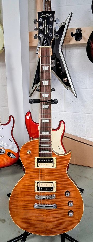 A sunburst Les Paul-style electric guitar with dual humbucker pickups.