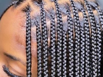 Close-up of neat black cornrow braids.