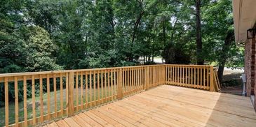 Buffalo, MN - new deck construction with railing and stairs in the backyard