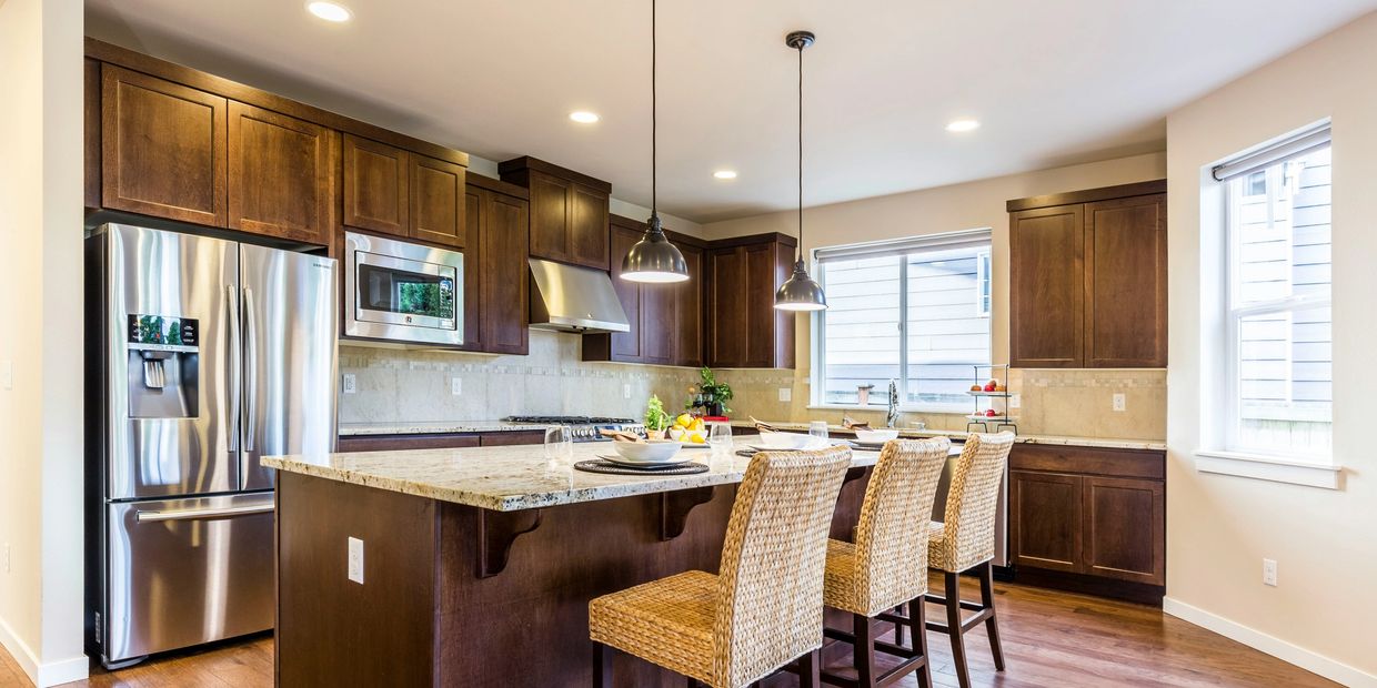 kitchen remodel, custom cabinets, large island, new appliances, new pendant lights