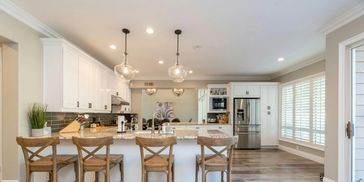 Annandale, MN - Kitchen Remodel with white cabinets, new appliances and room for four at the counter