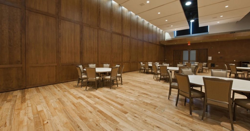 Large Operable Partition designed with wood grain/veneer finish and custom stained