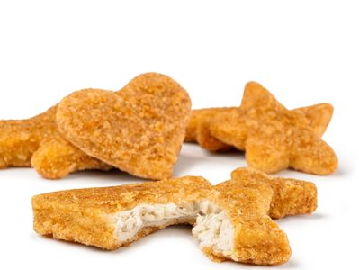 Breaded chicken nuggets shaped like stars and hearts.