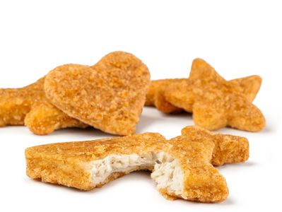 Breaded chicken nuggets shaped like stars and hearts.