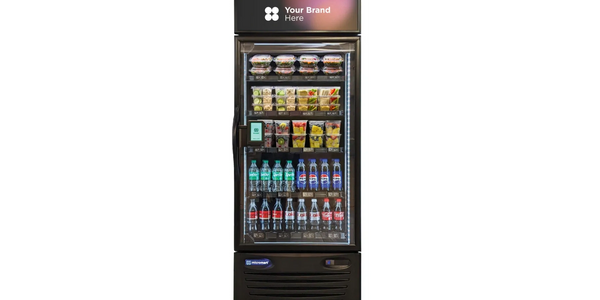 A sleek vending fridge stocked with drinks and snacks, customizable branding space.