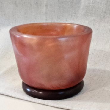 Peach resin bowl.
