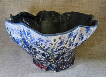 Decorative ceramic bowl with blue floral design.