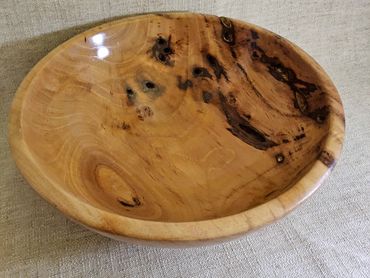 Handcrafted wooden bowl with natural grain patterns.