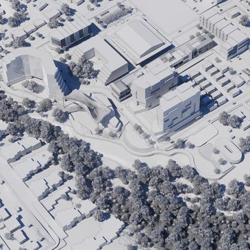 A detailed architectural model of an urban area with buildings and trees.
