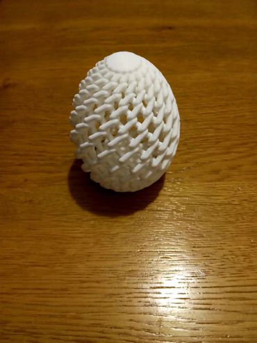 Intricate woven Easter egg that is a perfect festive decoration and charming collectible gift.